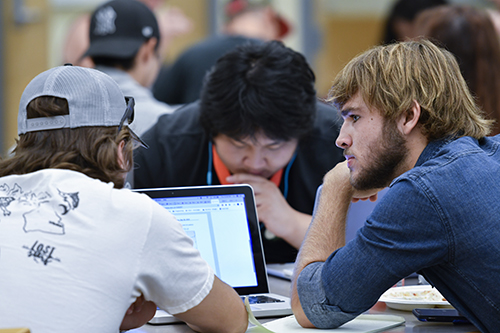 Three young men in a study group.