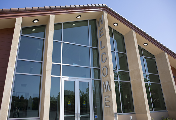 Image of the front facade of the Petaluma Welcome Center building, shot from ground level, view is up and to the right.