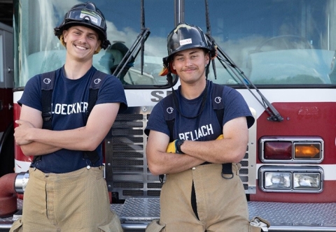 SRJC student Firefighters leaning on a truck