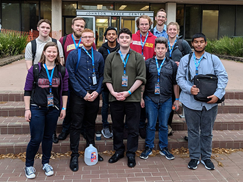 group of students in front of a building